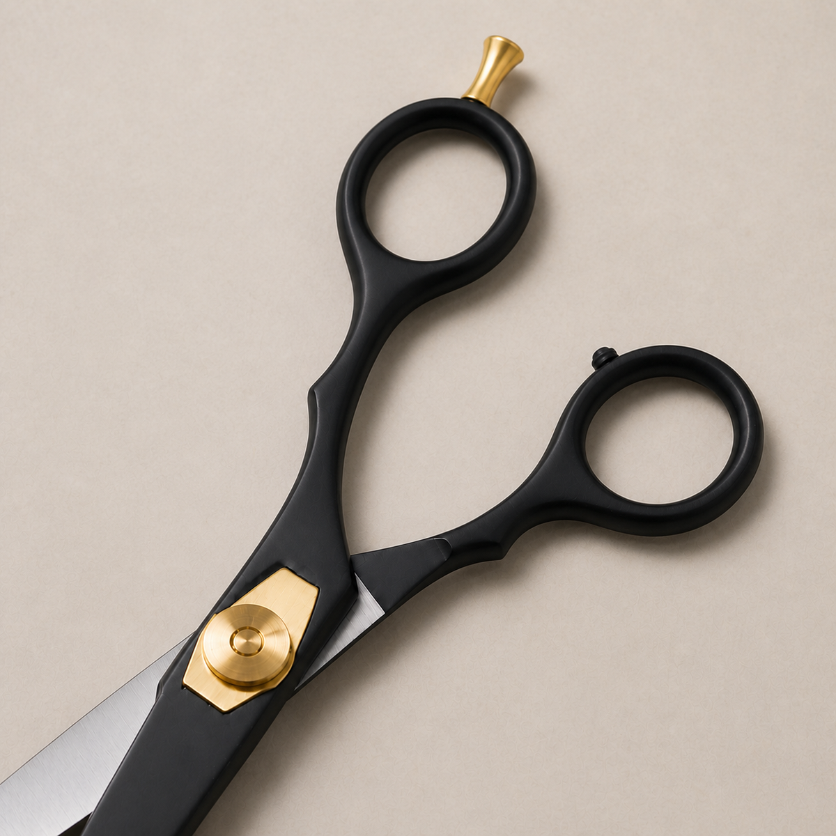 Close view of the black blades, gold pivot and finger rest on Diggn'It scissors